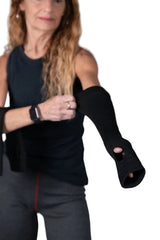 Woman wearing Seraphina 18-inch flame-resistant protective sleeves with thumb holes for industrial heat protection.