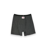 The image shows the back view of the Seraphina Safety Apparel Men's Boxer Brief that is grey in color with a 3" inseam. The logo label is applied to the center of the brief just below the 1" flame-resistant flat elastic waistband. 