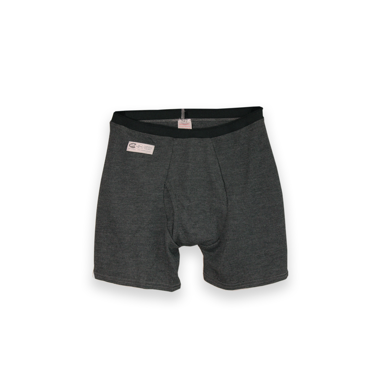 The image shows the front view of the Seraphina Safety Apparel Men's Boxer Brief that is grey in color and shows the attached SFI 3.3 Underclothing certification label. 