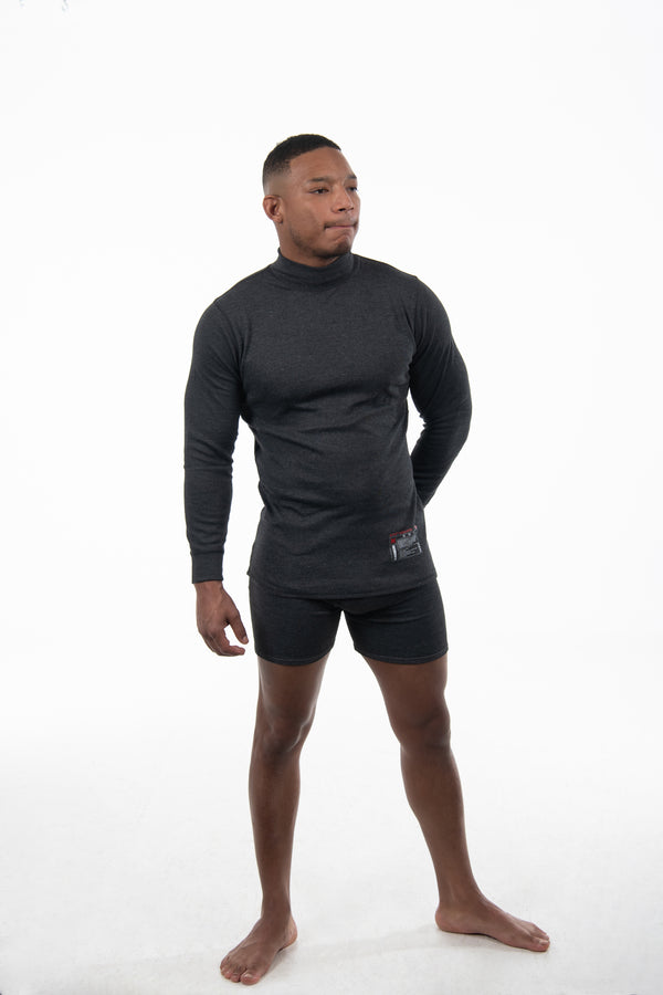 Man standing with his feet apart wearing a flame-resistant boxer brief with 3" inseam. The boxer brief is grey in color with a flat flame-resistant elastic band.