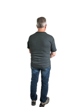 Back view of Man wearing Seraphina flame-resistant short sleeve shirt. Man is wearing jeans and safety shoes. 