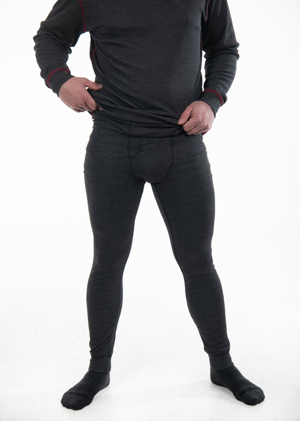 Image of man's body wearing Seraphina Safety Apparel's Men's FR Tech Cool Down flame-resistant base legging. The pant is dark grey in color and the man is wearing black socks. 